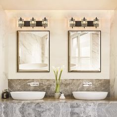 there are two sinks in the bathroom with mirrors above them