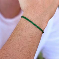 Step into a world of balance and well-being with our Green Adjustable Cord Bracelet. This unique accessory is not just a piece of jewelry; it symbolizes prosperity, health, and progress. Made from high-quality material, it's designed to last years while offering comfort and style. The rich green color, known for attracting prosperity and abundance, also embodies courage and confidence. Wearing this bracelet stabilizes your aura, bringing harmony and protecting against negative forces. Soft, comf Adjustable Cord Bracelet, Prosperity Bracelet, Prosperity And Abundance, Bracelet Pack, Cord Bracelet, Cord Bracelets, Good Fortune, Glass Necklace, Accessories Unique