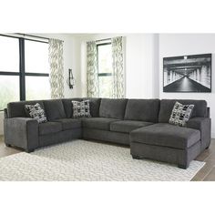 a living room with a large sectional couch