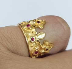 -PRODUCT TYPE - GOLD VERMEIL CROWN RING -MATERIAL - SILVER -PURITY - 18K MICRON - DETAILS OF ONE PIECE -TOTAL WEIGHT - 6.235 GRAMS -SILVER - 6.145 GRAMS -RUBY - 0.45 CARAT NO OF RUBY PIECES - 12 PIECES BAND WIDTH - 5.5 MM 18K Yellow Gold Vermeil Ring: Minimal & Simple, Dainty Handmade Yellow Gold Vermeil Bands. Rustic, Understated Luxury. - Delicate Handmade Yellow gold Vermeil ring. - Made to order, just for you. -Quality is guaranteed. Our mission is always to satisfy our customers with ou Gold Ruby Ring, 14k Gold, Handmade 14k Gold Ruby Ring, Handmade Gold Ruby Open Ring, Unique Gold Ruby Ring For Anniversary, Handmade Heirloom Ruby Ring In Gold, Ruby Crown, Ring Minimal, Ring Ruby, Understated Luxury