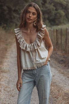 This airy top feels like summer memories waiting to happen. She may be simple at first glance, but all the details add up to heirloom status: delicate embroidery on the ruffles and trim; sweet covered buttons down the front, and a darling Swiss dot cotton fabric. In our new faded mint and mist shades, her slightly boxy Spring Cotton Embroidered Top With Ruffles, Cotton Ruffle Blouse For Gatherings, Bohemian Ruffled Lace Top For Summer, Chic Embroidered Ruffle Top For Summer, Bohemian Lace Top With Ruffles For Summer, Summer Cotton Swiss Dot Tops, Chic Summer Embroidered Top With Ruffles, Summer Swiss Dot Cotton Tops, Bohemian Blouse With Ruffles For Gatherings