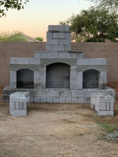 an outdoor oven made out of cinder blocks