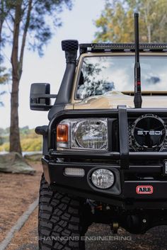 the front end of a truck with its lights on