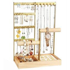 a wooden jewelry rack with several necklaces and watches