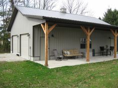 a large metal building with a covered patio