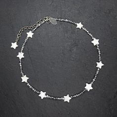 ⭐️This choker is a stunning piece of jewelry made from small faceted silver beads, is adorned with pearl star-shaped inserts, adding a whimsical touch to the design  The star-shaped inserts are carefully placed along the length of the choker, creating a visually appealing contrast against the silver beads It can be paired with a simple white tee and jeans for a trendy and chic look, ideal for casual style! It will look great and stylish in a multi-layer composition, see the photo! Whether you're Silver Star Necklace, Star Choker, Jewelry Star, Star Necklace Silver, Neck Accessories, Hippie Necklace, Celestial Jewelry, Gift For Daughter, Star Jewelry