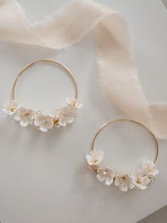 A stunning pair of handcrafted Cherry Blossom floral bridal hoop earrings , with tiny subtle Swarovski crystal stamen centres. Each flower is intricately handcrafted and wired with delicate crystal.  The perfect feminine, statement wedding earrings to complete your bridal look. These bridal earrings are perfect for todays modern bride. Please note earrings are NON refundable. Processing time 3-5 days If you would like your order sooner, please get in touch as I am always happy to accommodate you Floral Gold Jewellery, Wedding Hoop Earrings, Bridal Hoop Earrings, Gold Flower-shaped Hoop Earrings For Wedding, Handmade Small Hoop Earrings For Wedding, Delicate Flower Charm Hoop Earrings, Elegant Flower-shaped Hoop Earrings For Wedding, Handmade Hoop Earrings For Wedding, Dainty Hoop Earrings With Flower Charm