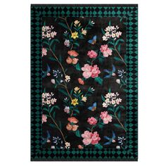 a black rug with flowers on it