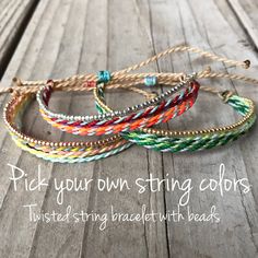 four different colored bracelets with the words pick your own string colors twisted in each other