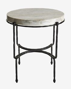 a white marble top table with black metal legs and an iron frame around the base