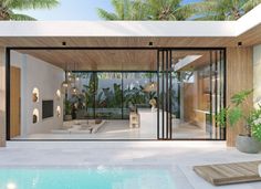 a modern house with an outdoor pool and lounge area next to the swimming pool is surrounded by palm trees