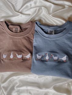 "Embroidered Geese T-Shirt -Embroidered on 100% Cotton, Comfort Colors Brand T-shirts. This design is simple and minimalistic, perfect for every outfit!  -Embroidery design measures 5\"x 1.5\" -See product pictures for shirt sizing chart. These t-shirts run true to size, so if you like an oversized look, we recommend sizing up 1 size!  -All t-shirt designs are handmade on an embroidery machine so there may be slight differences, but we only sell the shirts that meet our high-quality standards. - Blue Shirt Embroidery, Embroidered Tee Shirt, Embroidered Tee, Shirt Embroidery, Product Pictures, Embroidered Sweatshirts, Embroidered Shirt, Blue Shirt, Sizing Chart