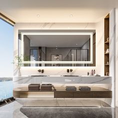 a bathroom with a large mirror above the sink and marble counter tops on both sides