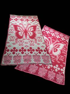 two pieces of red and white crocheted fabric with butterflies on them, one in the