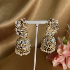 Very light gold mixed metal earring with mirror detail on peacock design.  1.5 inch x 0.5 inch  Light weight and perfect for festivals NOTE mirrors may have slight imperfections as item is hand made  Ready to ship! Kundan Earrings With Peacock Design For Celebrations, Gold Jewelry With Mirror Work For Navratri, Festive Peacock Chandbali Earrings, Festive Chandbali Earrings With Peacock Design, Festive Peacock Design Chandbali Earrings, Navratri Gold Jewelry With Mirror Work, Gold Kundan Chandbalis With Peacock Design, Festival Peacock Design Jhumkas For Parties, Peacock Design Jhumkas For Party And Festivals