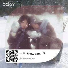 two people are hugging in the snow with qr code for polar pictures on them