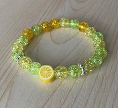 Summer and brightly colored beaded stretch bracelet featuring glass beads and an adorable lemon charm bead.  Available in sizes for kids and adults. 📧  Email Signup Link 📧 Signup for our email list at the link below for updates and special offers https://tinyurl.com/2mh6c8t 🚨⚠️ Reminder ⚠️🚨 Handmade jewelry will not be exactly the same as the picture, some beads may be different than pictured but the color and style will remain consistent. Choking Hazard Warning: This product contains small Yellow Stretch Bracelet With Faceted Beads For Gift, Yellow Stretch Bracelet With Colorful Beads As Gift, Playful Yellow Beaded Stretch Bracelet, Playful Yellow Stretch Bracelet With Colorful Beads, Cute Yellow Stretch Bracelet, Perfect As Gift, Cute Green Stretch Bracelet With Round Beads, Cute Yellow Stretch Bracelet, Gift, Cute Green Round Beads Stretch Bracelet, Cute Yellow Stretch Bracelet As A Gift