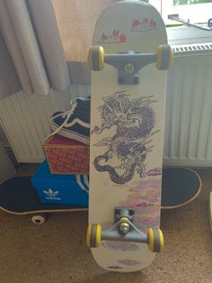 a skateboard with an image of a dragon on it