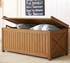 a wooden storage box sitting on the floor