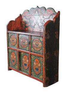 an old wooden bench with painted designs on the front and back sides, sitting against a white background