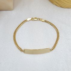 Lovely 14k Gold Close Curb link Baby ID bracelet with name engraving. comfortable and perfect for everyday use. Solid 14k gold will not tarnish or rust Adorable, Comfortable, and Everlasting.  Engraving is included. Font Style: Cursive or block (like pictures) Materials: 14k Gold Length: 6 in  Thickness: 2.9 mm Weight: 5.1 grams Plate length: 29mm 14k gold stamped Brand new Briza Collections is a small family business that works hard on providing the best selection of Fine Solid Gold Jewelry for the best prices. Our Goal is to bring you happiness and satisfaction, for this reason if you are not satisfied with your purchase we will accept Refunds and exchanges. In order to get a refund let us know within 14 Days after you received the package and i will give you the details on how to procee Gold Nameplate Chain Bracelet For Everyday Wear, Yellow Gold Plated Name Bracelet, Tarnish Resistant, Everyday Gold Nameplate Chain Bracelet, Classic 14k Gold Name Bracelet With Jubilee Link, Classic 14k Gold Name Bracelet With Jubilee Detail, Classic 14k Gold Name Bracelet With Jubilee Design, Yellow Gold Plated Name Bracelet, Classic Gold Engraved Name Bracelet, Tarnish Resistant Yellow Gold Plated Name Bracelet