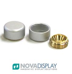 an image of two metal knobs and a gold plated button on a white background