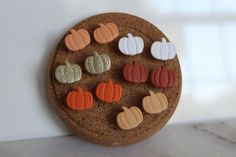 there are many small pumpkins and gourds on this cookie