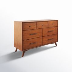 a wooden dresser with six drawers and two legs