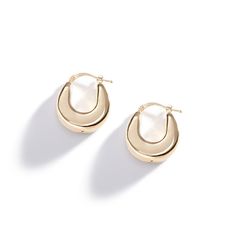 Add some retro flair to your ensemble with these 70s inspired puffy hollow hoops. Made of 14k gold with a mirror-like finish. Modern Hoop Earrings With Gold-tone Hardware, Retro Small Hoop Gold Jewelry, Retro Gold Round Hoop Earrings, Retro Gold Small Hoop Jewelry, Gold Retro Round Hoop Earrings, Retro Small Hoop Gold Earrings, Chic Gold Oval Hoop Earrings, Three Sisters Jewelry, Sisters Jewelry