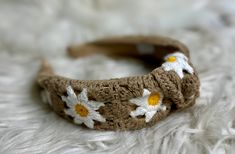 Add a touch of spring and summer to your look with this crochet headband featuring a dainty daisy print. Perfect for adding a cute, fashionable touch to any outfit. Trendy Spring Headband, Trendy Spring Beach Headband, Casual Beach Hair Accessories For Summer, Casual Summer Beach Hair Accessories, Spring Beach Headband, Adjustable Trendy Spring Headband, Adjustable Headband For Beach In Spring, White Hair Accessories For Beach In Spring, Summer Casual Hair Accessories With Matching Headband