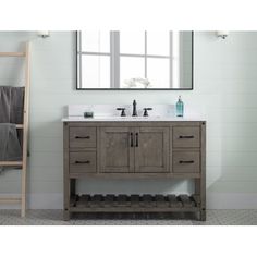 a bathroom vanity with two sinks and a ladder