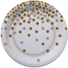 a white and gold polka dot paper plate