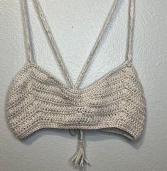 Handmade (by my mom!) crochet floral halter/festival top. Great 70's vibes! Cream colored with pink flecks.  Halter/Crop with cross back. Would fit a XS - M depending how much skin you like showing. Spring Festival Halter Top With Crochet Trim, Spring Festival Crochet Halter Neck Top, Festival Crochet Stretch Halter Top, Festival Crochet Halter Neck Top, 70s Crochet Halter Tops, Cross Top, 70s Vibes, Knit Ideas, Festival Tops