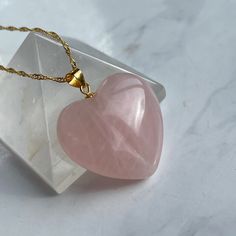 ♡ Rose Quartz heart in gold filled chain to show your love and tender feelings! Comes in luxury gift box and postcard! Rose quartz helps against stress, relieves emotional stress, calms down, makes your heart spread happiness and love. It removes the pain of old emotional and heart issues.💖 Rose quartz enhances self-esteem and self-confidence, improves mutual understanding between people. This stone gives vitality to its owner, promotes the development of sensuality, increases creativity ꕥ One Heart Rose Quartz, Romantic Gifts For Girlfriend, Rose Quartz Jewelry, Heart Rose, Rose Quartz Pendant, Rose Quartz Heart, Quartz Jewelry, Luxury Gift Box, Quartz Rose