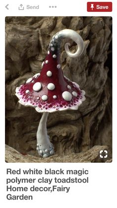 a red and white mushroom shaped lamp on top of a tree stump with the caption'red white black magic polymer clay toadstool home decor, fairy garden