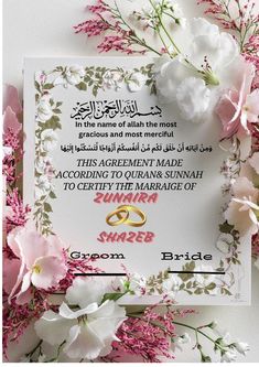 the wedding card is surrounded by flowers