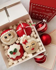 an open box filled with christmas cookies and ornaments