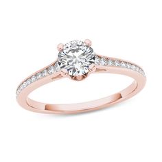 Classic and elegant, this diamond engagement ring will win her heart - and her hand. Fashioned in precious 14K rose gold, the eye is drawn to the 5/8 ct. round diamond center stone. Smaller round diamonds adorn the ring's tapered shank, completing this traditional design. A breathtaking look she'll love, this engagement ring captivates with 3/4 ct. t.w. of diamonds and a polished shine. Diamond Clarity, Diamond Stone, Stone Settings, Diamond Engagement Ring, Traditional Design, Round Diamond, Prong Setting, Ring Designs, Diamond Engagement