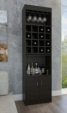 a black cabinet with bottles and glasses on it