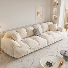 a living room filled with furniture and white walls