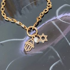 Our elegant Star of David & Hamsa Hand necklace is crafted in beautiful Gold Filled material. The necklace features both the sacred symbols, bringing protection and harmony to its wearer. Embrace the spiritual connection and enjoy the timeless beauty of this piece.     14k Gold Filled   Chain length 18”  Tarnishing resistant   Hypoallergenic   Please note that chemicals and perfume can shorten the life span   Clean your jewelry after each wear with YUMIYU Pouch  Waterproof   Email us  for custom orders :)   Orders ship in 1-3 business days  High-polish, 14k gold finish Hamsa And Star Of David Necklace, Hamsa Hand Necklace, Hand Necklace, Sacred Symbols, Spiritual Connection, Hamsa Hand, Everyday Luxuries, Star Of David, Gold Filled Chain