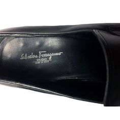 "SALVATORE FERRAGAMO BLACK Loafer Men's Shoes Size 12 Retail Price: $495 Style: Loafers This Salvatore Ferragamo loafer has an elegant, Old World design sits atop a leather sole, melding traditional, high-end craftsmanship with modern practicality and comfort. Moc toe. Slip-on. Tonal heel counter. 1\" stacked heel Leather sole. This loafer is made in Italy. ITEM CONDITION: Excellent Pre Owned Condition ABOUT FERRAGAMO: A native of Naples, Italy, Salvatore Ferragamo was a teenaged shoe apprentice Designer Tassel Loafers With Rubber Sole For Business, Black Tassel Loafers With Leather Lining, Designer Slip-on Tassel Loafers For Business, Designer Business Tassel Loafers Slip-on, Designer Business Tassel Slip-on Loafers, Designer Black Leather Tassel Loafers, Black Tassel Loafers With Moc Toe And Leather Lining, Black Branded Insole Tassel Loafers For Semi-formal Occasions, Designer Black Tassel Loafers With Leather Sole