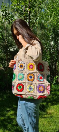 I'm crocheting grandma's knit bags for you. This wonderful floral daisy crochet bag is the perfect accessory for your summer and winter outfit. Summer is so close and the sun is shining everywhere, it's time for summer fashion :) -This awesome crochet bag is the perfect accessory for your summer and winter outfit. - Soft and bright colors in cute granny square. -Crochet bag has enough space for all your belongings :) -Fully handmade crochet after my own design. - The crochet bag is a great gift Beige Rectangular Crochet Bag With Granny Square, Rectangular Crochet Bag In Beige With Granny Square, Rectangular Beige Crochet Bag With Granny Square, Rectangular Knitted Bag For Everyday Use, Everyday Rectangular Knitted Bag, Multicolor Rectangular Yarn Bag, Multicolor Crochet Yarn Bag, Hand Knitted Rectangular Crochet Bag For Crafting, Bohemian Granny Square Crochet Bag For Crafting