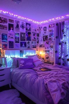 a bedroom with purple lights and pictures on the wall