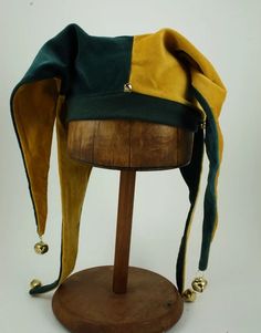 a hat is sitting on top of a wooden stand