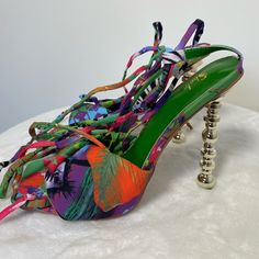 Size 6.5 Multicolored Sandal. Never Worn. Vacation Heels With 4-inch Heel, Vacation High Heels, Colorful Pointed Toe Heels For Summer, Vacation High Heels With Wrapped Heel, Beach Season Party Heels With Round Toe, Multicolor Summer Beach Heels, Spring Multicolor Heels, Multicolor High Heel Summer Sandals, Colorful High Heel Sandals For Summer