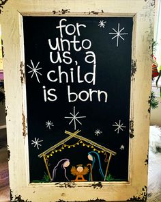 a chalk board with the words for unto us a child is born