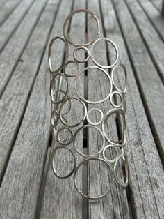 a metal object sitting on top of a wooden table