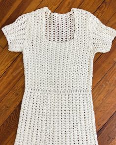 "An authentic vintage crochet sweater dress. very comfortable. slips on over head, no fasteners era : 1940s material : orlon (synthetic yarn) color : white condition : excellent! little to no signs of age and wear aside from two small spots as pictured size : small  - please compare measurements below actual garment measurements : chest : 34-36\" waist : 28\" hip : up to 40\"  length : 45\" - - - - - - - - - - - - - - - - - - - - - - - - - - - - - - - - - - - - - - - -  INTERNATIONAL SHIPPING AVAILABLE UPON REQUEST Craft Union does NOT accept returns or exchanges, all items are FINAL SALE Please consider the following prior to placing an order : Because measurements are provided, Craft Union does NOT grant refund/exchange requests if an item does not fit. We are always happy to assist inte White Fitted Knit Crochet Dress, Fitted Cream Crochet Lace Dress, White Fitted Crochet Dress With Crochet Trim, Vintage Fitted Open Knit Crochet Top, Vintage White Crochet Lace Dress, White Fitted Crochet Top With Knit Fabrication, White Fitted Vintage Crochet Dress, Fitted Vintage Crochet Lace Dress, White Fitted Hand-knitted Crochet Top