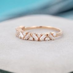 a diamond ring sitting on top of a rock